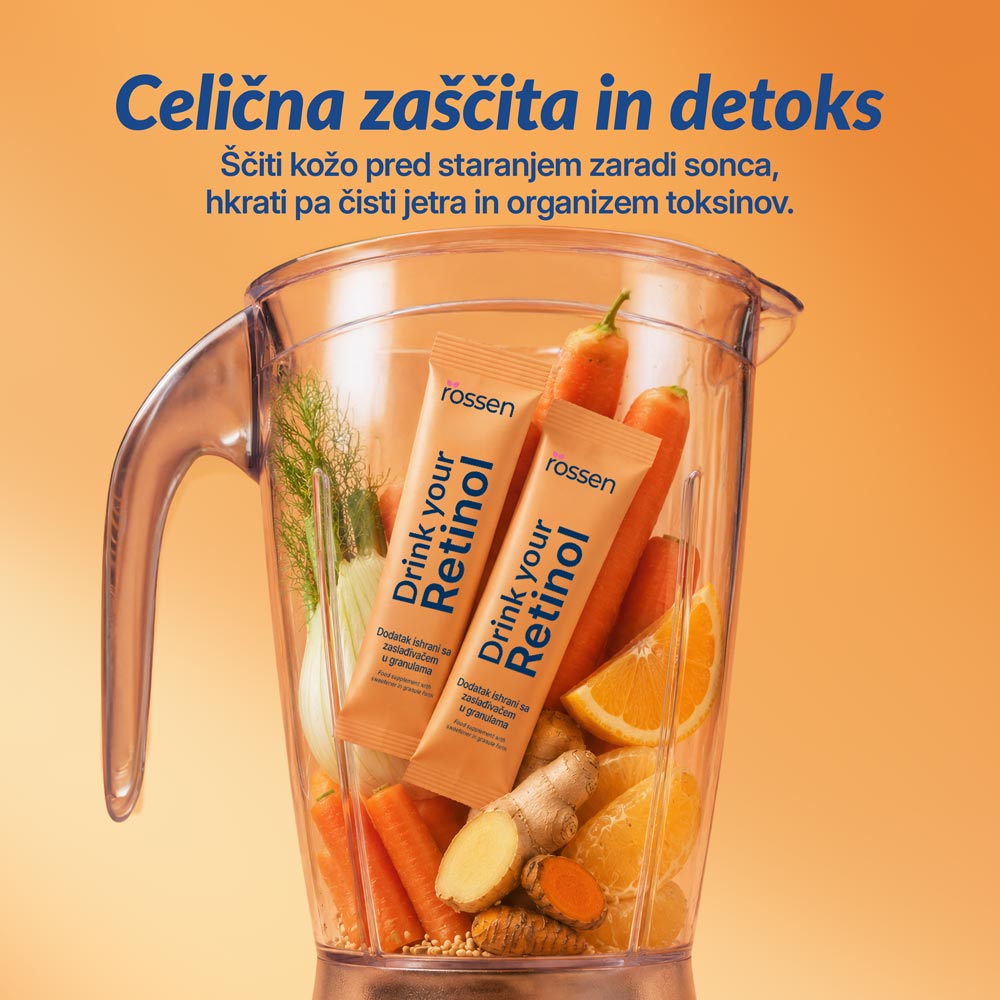 Blender on an orange background filled with carrots, orange slices, ginger and two 'Drink your Reetinol' sachets; promotes cellular protection and detox.