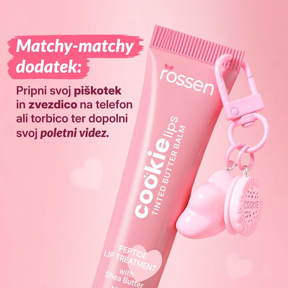 Pink lip balm tube with 'cookie lips' branding and a heart-shaped charm/keychain, set against a pink promotional background.
